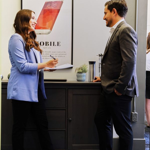 standing by desk working